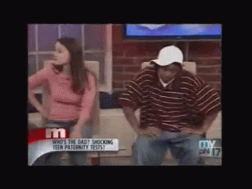 Woman in Pink Shirt Next to Man in Stripes
