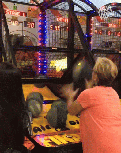Woman in Pink Shirt Playing Game Scoreboard Stage 1