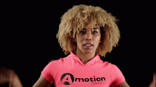 Woman In Pink Shirt Saying A Motion Dance GIF