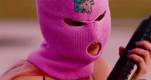 Woman in Pink Ski Mask Holding Gun