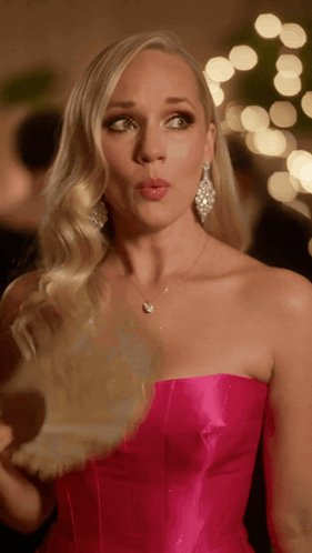 Woman In Pink Strapless Dress With Necklace And Earrings GIF