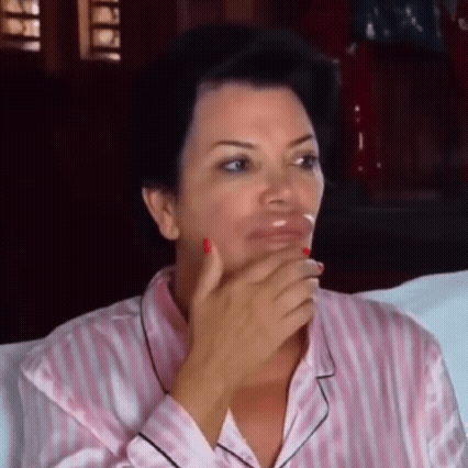 Woman in Pink Striped Pajama Covering Mouth