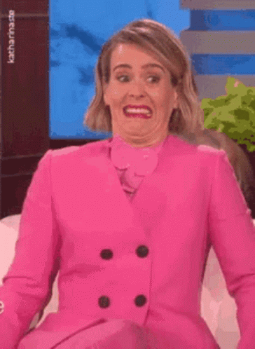Woman in Pink Suit Making Funny Face