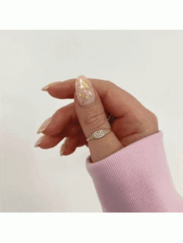 Woman in Pink Sweater and Gold Ring