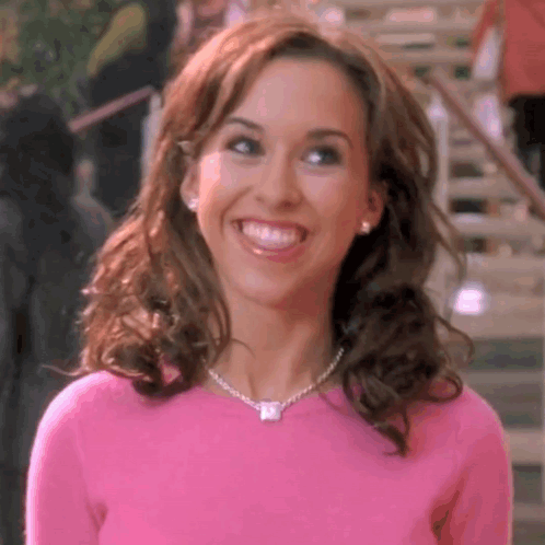 Woman in Pink Sweater and Necklace Smiling