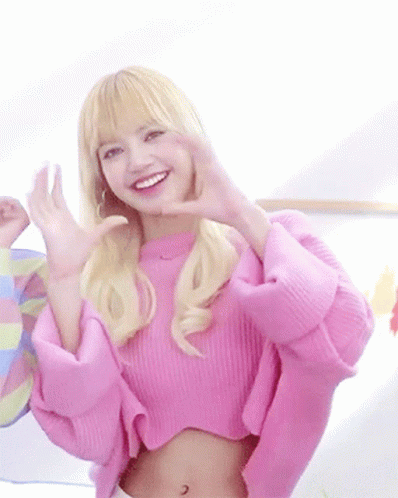 Woman in Pink Sweater Making Heart With Hands