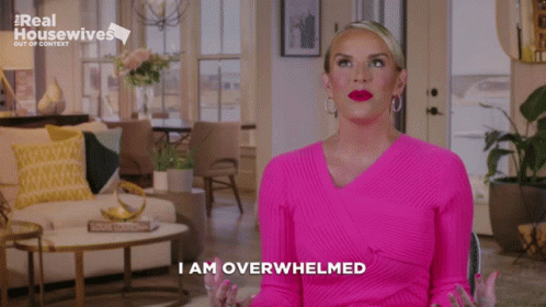 Woman in Pink Sweater Saying I Am Overwhelmed