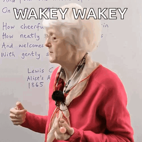 Woman in Pink Sweater Saying Wakey Wakey