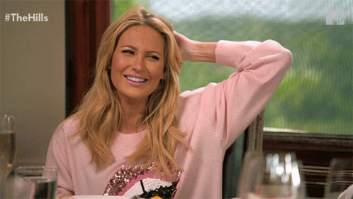 Woman in Pink Sweater Smiling