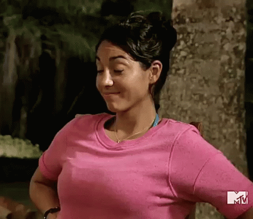 Woman in Pink T-shirt Standing in Front of Tree