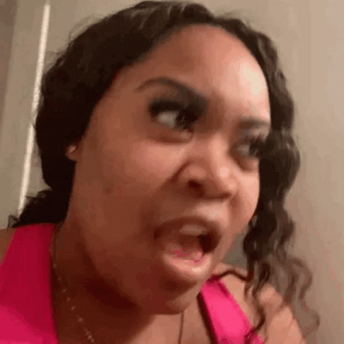 Woman in Pink Tank Top Making Funny Face