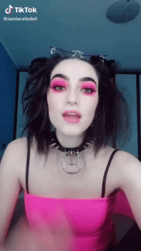 Woman in Pink Top and Choker With TikTok Watermark