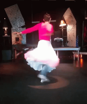 Woman In Pink Top And White Skirt Dancing GIF