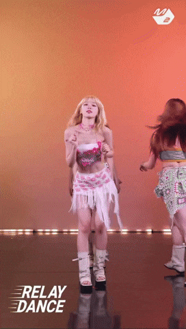 Woman in Pink Top and White Skirt Dancing