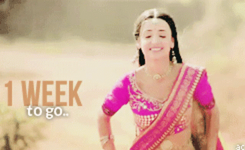 Woman in Pink Top Smiling 1 Week to Go