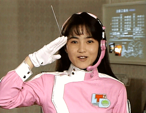 Woman in Pink Uniform With T2 Badge