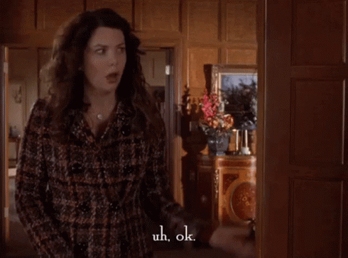 Woman in Plaid Coat Saying Uh Ok
