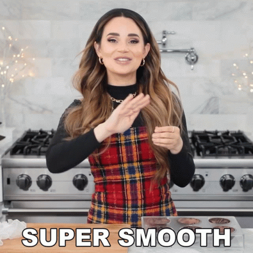 Woman in Plaid Dress Standing by Stove