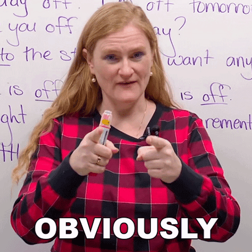 Woman in Plaid Shirt Pointing at Camera Obviously