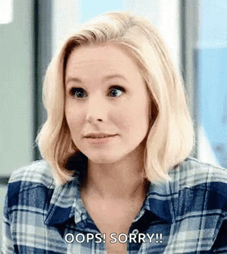 Woman in Plaid Shirt Saying Oops Sorry