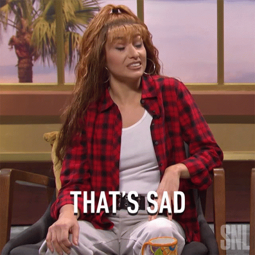 Woman in Plaid Shirt Saying That's Sad