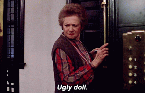 Woman in Plaid Shirt Saying Ugly Doll