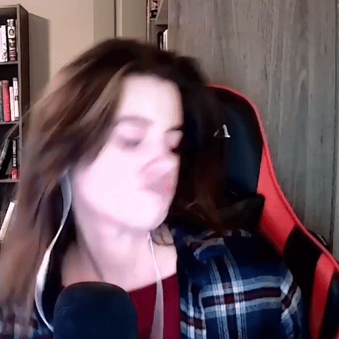 Woman in Plaid Shirt Singing