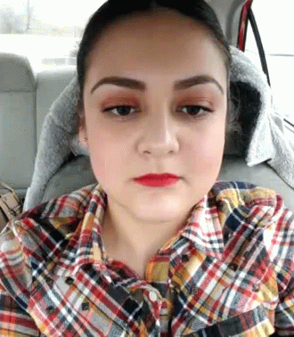 Woman in Plaid Shirt Sitting in Back Seat of Car