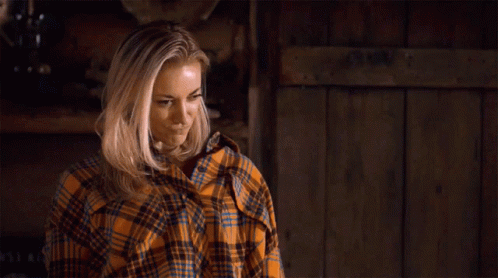 Woman in Plaid Shirt Standing by Sign You Are Thriving Girl