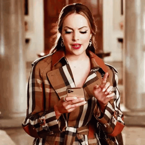 Woman in Plaid Trench Coat Holding Cell Phone