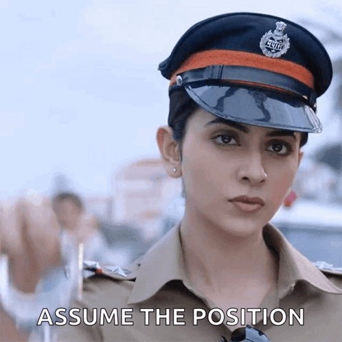 Woman in Police Uniform Assume the Position