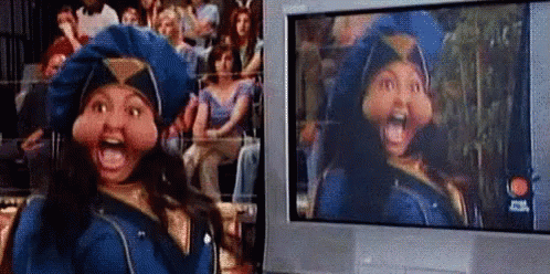 Woman In Police Uniform At Television Screen GIF