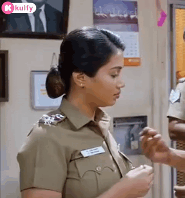 Woman in Police Uniform Standing Next to Man