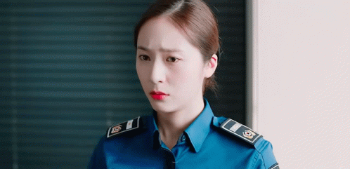 Woman in Police Uniform With Red Lipstick