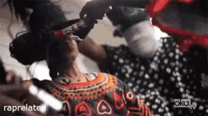 Woman in Polka Dot Dress Getting Hair Done