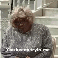 Woman In Polka Dot Shirt Sitting On Stairs GIF