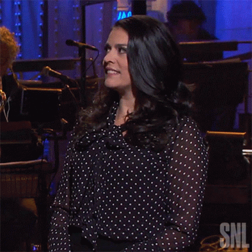Woman in Polka Dot Shirt with SNL Logo