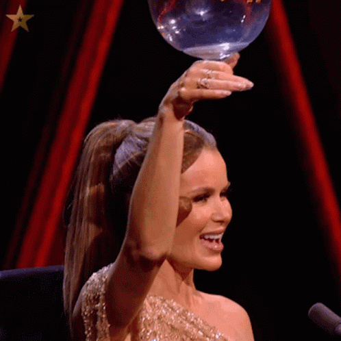 Woman In Ponytail Holding Glass And Smiling GIF