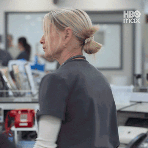 Woman in Ponytail in Front of HBO Max Logo