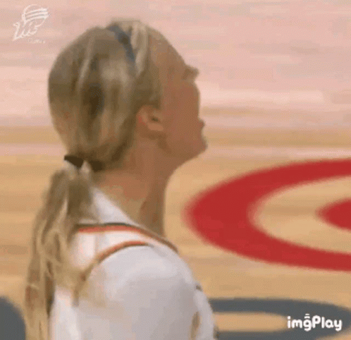 Woman in Ponytail Looking Up on Basketball Court