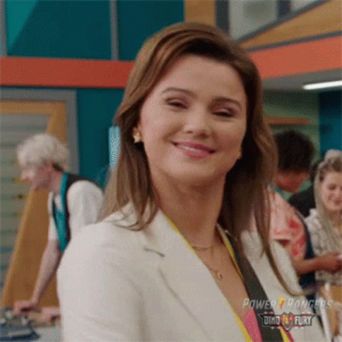 Woman In Power Rangers Uniform Smiling GIF