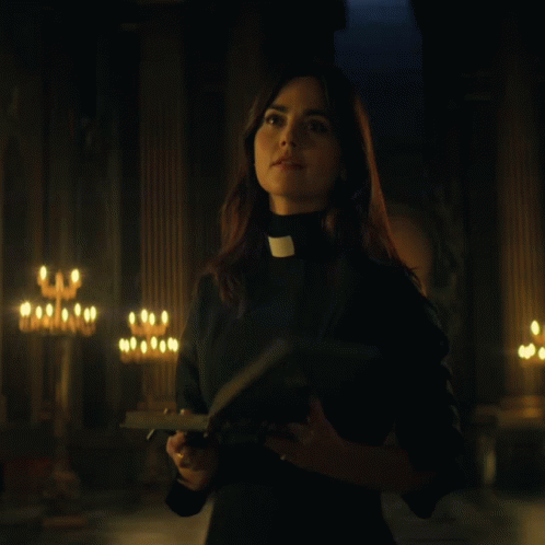 Woman in Priest Collar Holding Bible