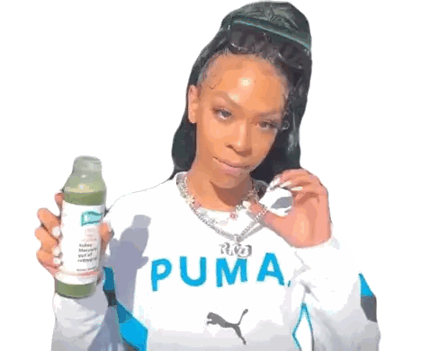 Woman in Puma Shirt Holding Juice Bottle