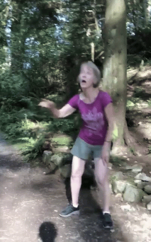 Woman In Purple Adidas Shirt Dancing In Woods GIF