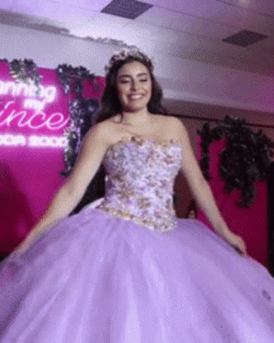Woman in Purple Ball Gown Smiling