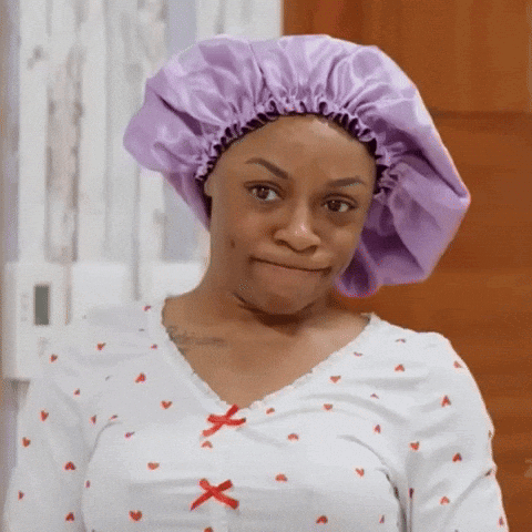 Woman in Purple Bonnet and Shirt With Hearts