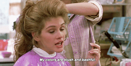 Woman in Purple Cape Getting Hair Dyed