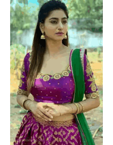 Woman in Purple Crop Top and Green Skirt