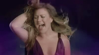 Woman in Purple Dress Dancing