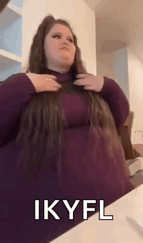 Woman in Purple Dress Holding Hair